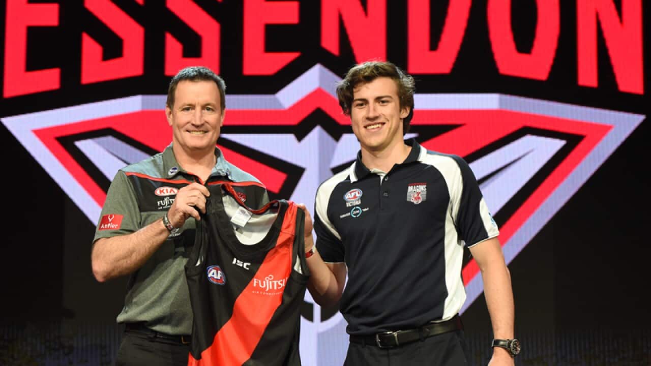 Andrew McGrath (right) with Essendon coach John Worsfold (left)