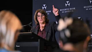 RBA Governor Michelle Bullock speaks at a podium.