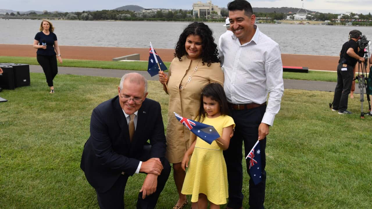 Prime Minister Scott Morrison poses for a photo with new citizens during an Australia Day Citizenship Ceremony and Flag Raising event in Canberra, Tuesday, January 26, 2021. (AAP Image/Mick Tsikas) NO ARCHIVING