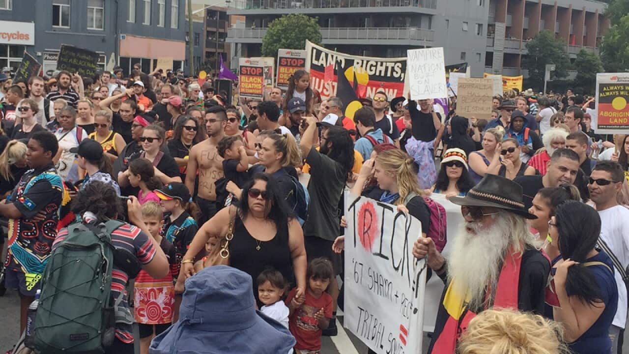 Protesters seen during Sydney's "Invasion Day" march in Redfern