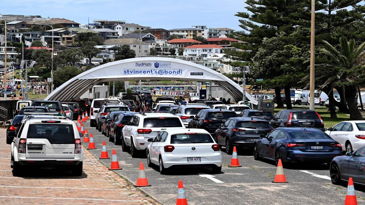 Lines of cars are seen as members of the public wait for a COVID-19 test at the St Vincents Hospital drive-through testing clinic at Bondi Beach in Sydney, Sunday, December 19, 2021. NSW is recording more COVID-19 cases than ever before as the Omicron var
