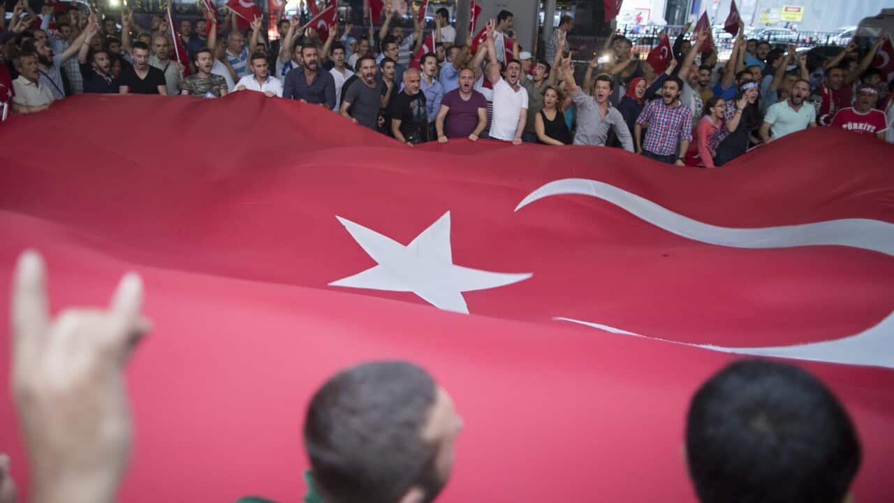 Supporters of Nationalist Movement Party shout slogans against PKK as they hold Turkish flags during a rally in Istanbul, Turkey, 08 September 2015. (EPA/TOLGA BOZOGLU)