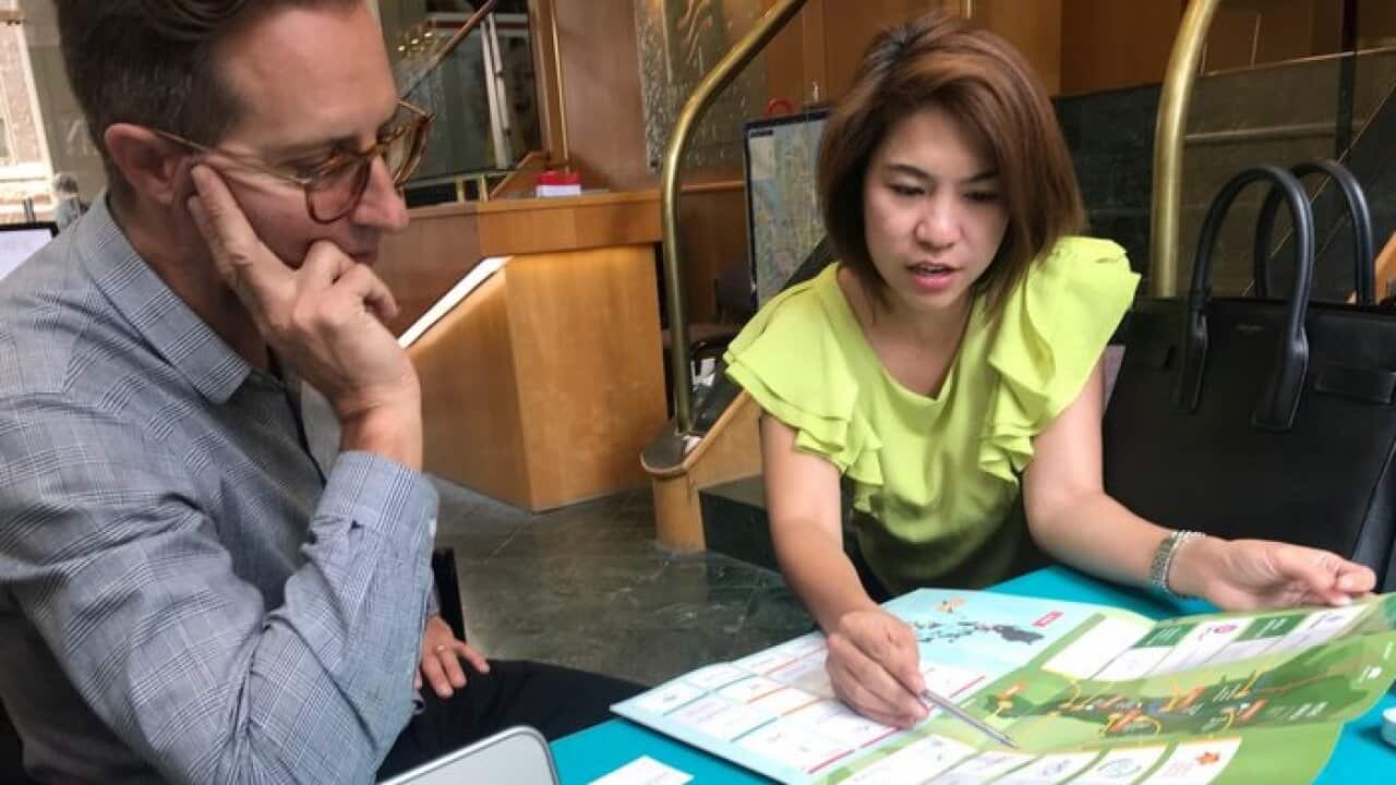 Dinah Castillo discusses property prospects with a potential investor in a session in Sydney