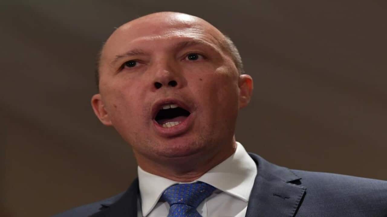 Federal Immigration Minister Peter Dutton speaks to the media.
