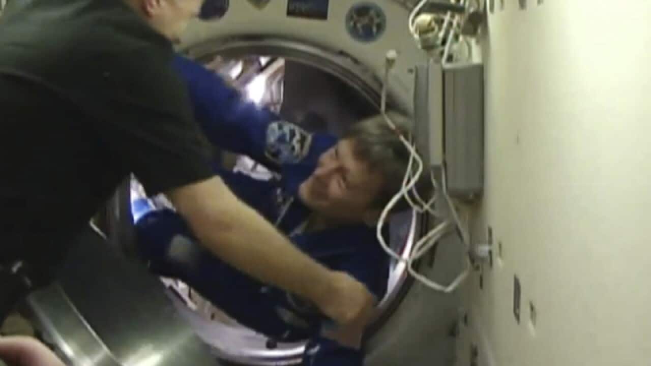 Astronaut Peggy Whitson boards the International Space Station