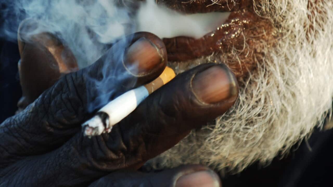 Aboriginal man smoking a cigarette