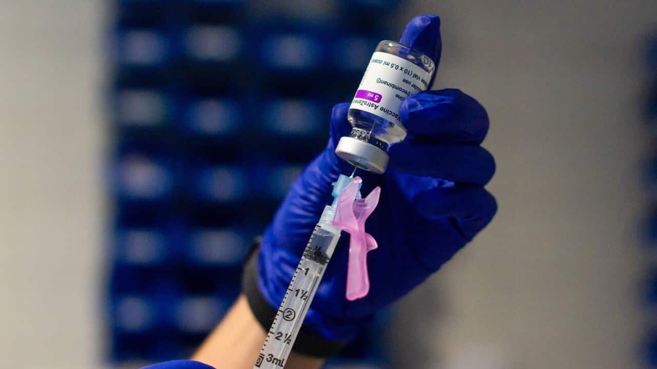 A healthcare worker prepares a syringe with the AstraZeneca Covid19 vaccine
