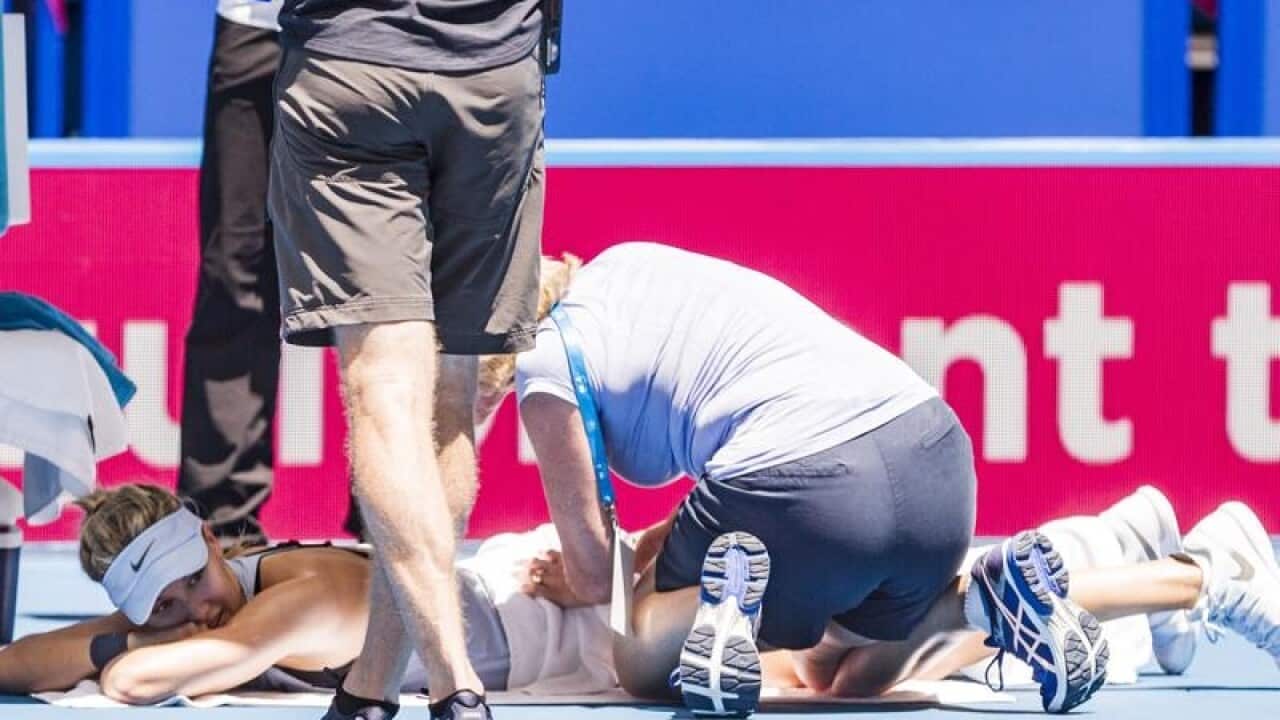 Canadian tennis player Eugenie Bouchard receives medical attention