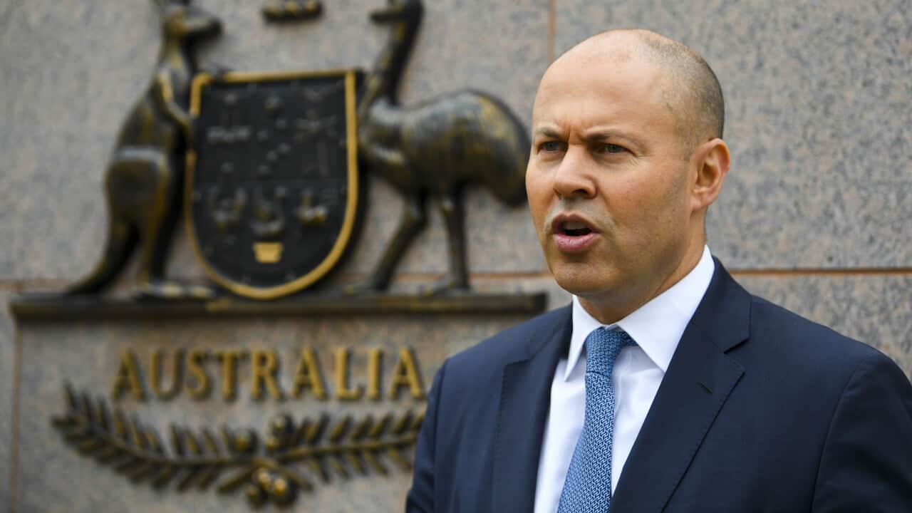 Australian Treasurer Josh Frydenberg poses for photograph outside the Treasury Department building in Canberra, Thursday, March 24, 2022. (AAP Image/Lukas Coch) NO ARCHIVING
