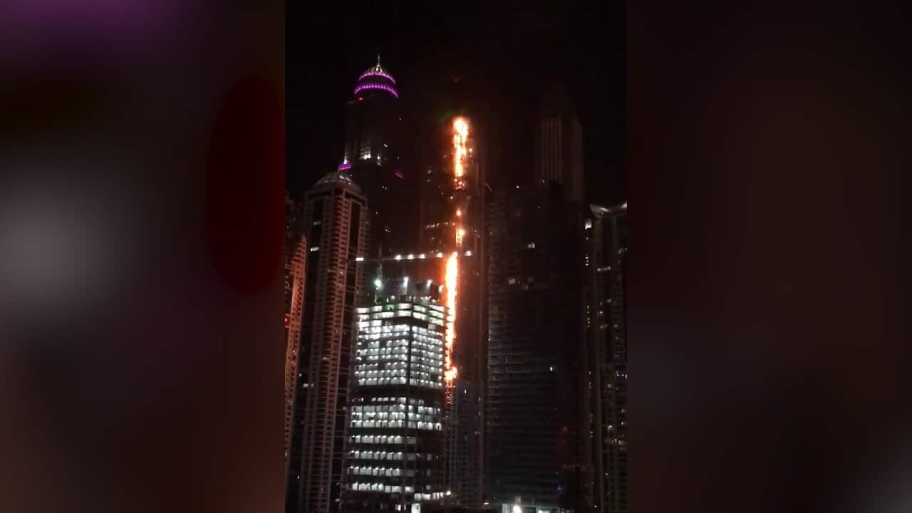 A massive blaze is engulfing one of the world's tallest residential buildings in Dubai.