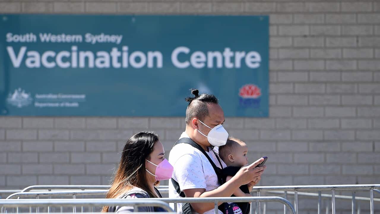 People are seen arriving at the South Western Sydney Vaccination Centre, at Macquarie Fields, Sydney, Friday, September 24, 2021