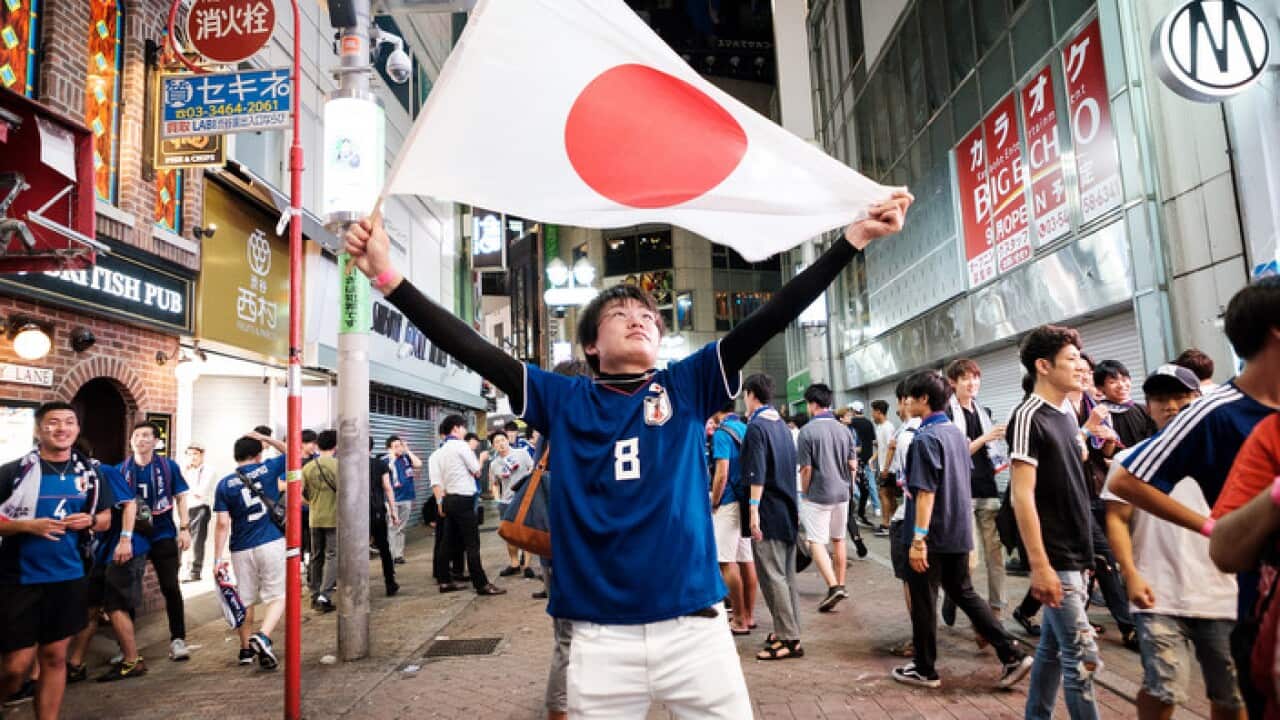 Japanese Watch FIFA World Cup Match Against Poland