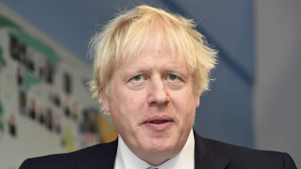 Britain's Prime Minister Boris Johnson visits Pimlico Primary school in London on Tuesday.