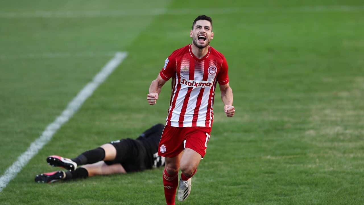 Giorgos Masouras celebrating his goal, bringing OFI - Olympiacos to 0-2