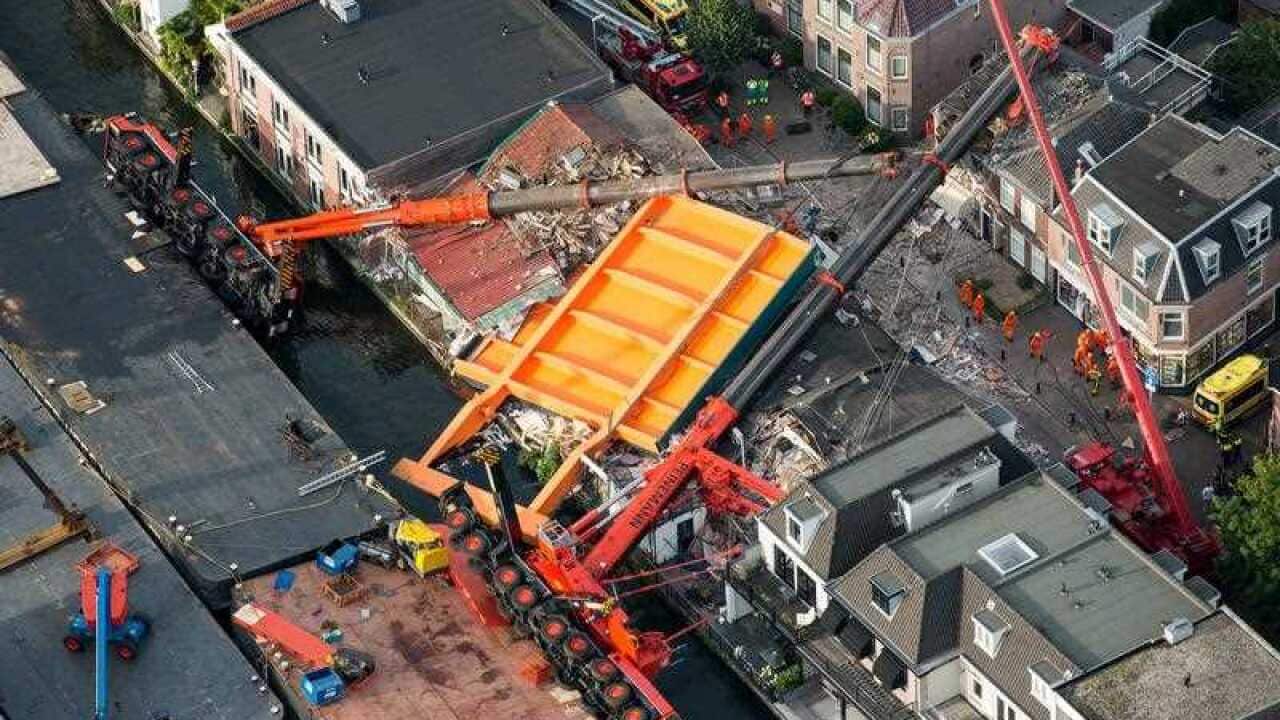 An aerial view of the area where two cranes fell onto a row of houses in Alphen aan den Rijn, the Netherlands, 03 August, 2015.