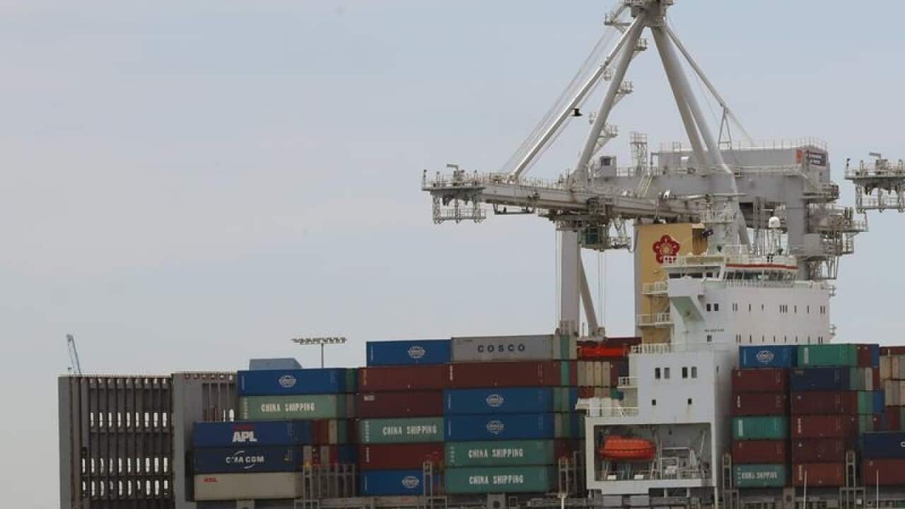 A cargo ship is seen being loaded