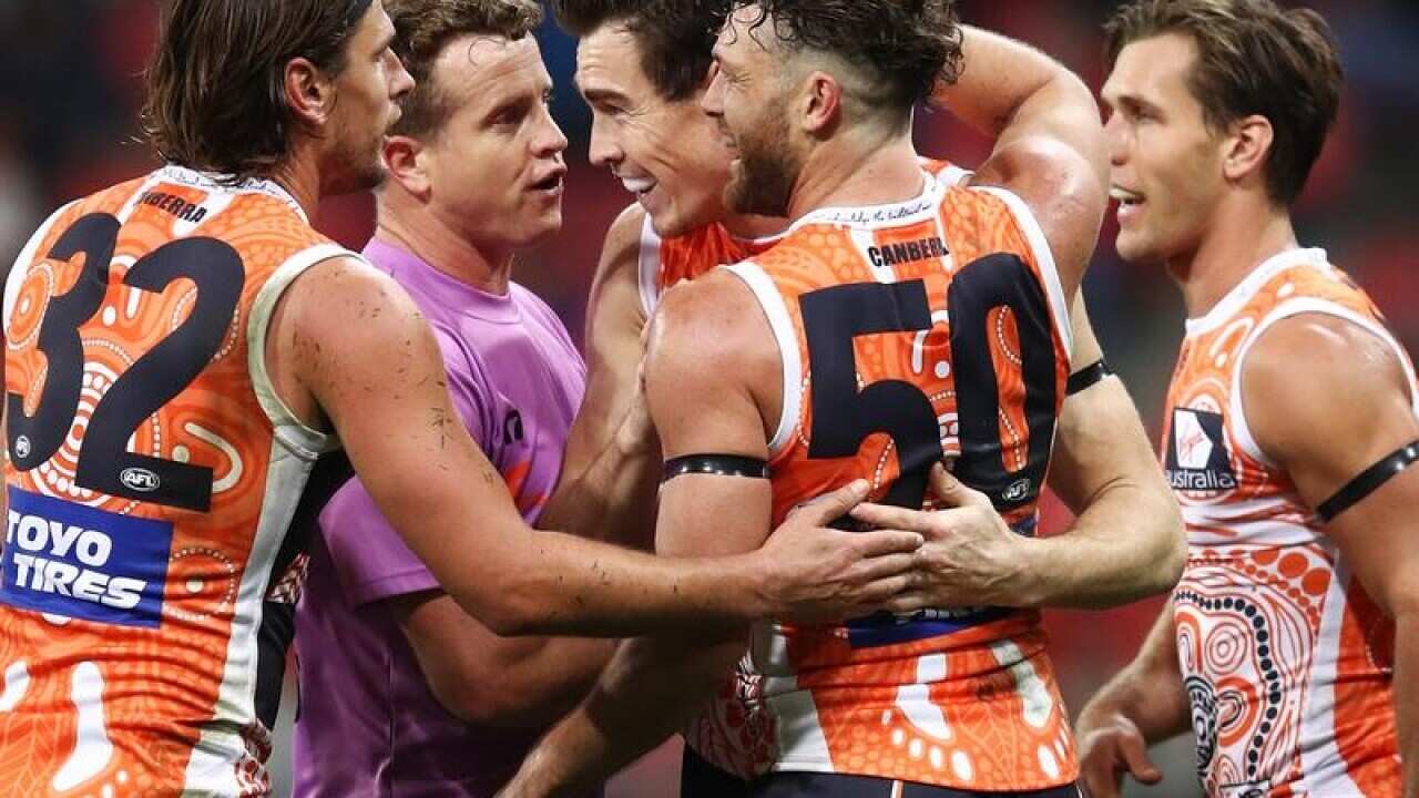 Jeremy Cameron of the Giants celebrates with teammates.