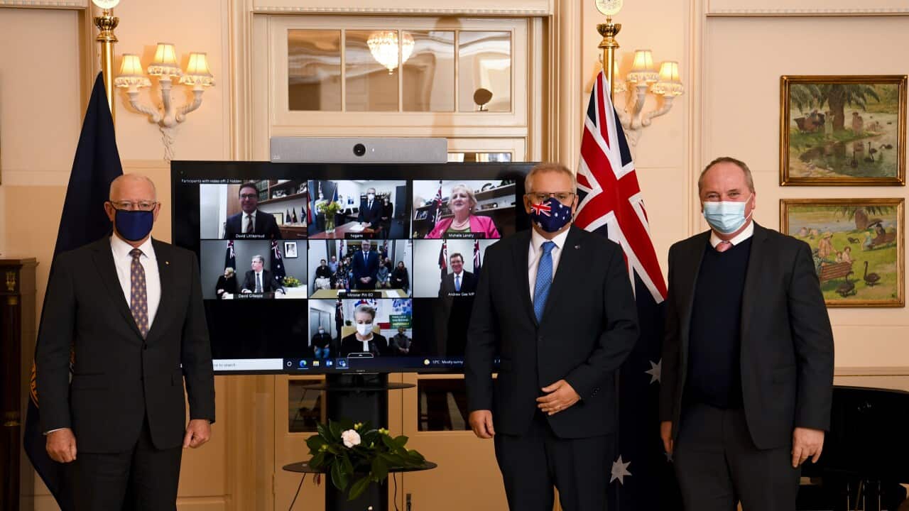 Prime Minister Scott Morrison and Australian Deputy Prime Minister Barnaby Joyce pose for an official photograph with newly sworn-in ministers
