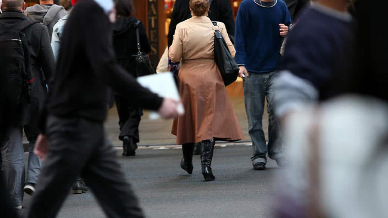 Pedestrians cross the intersection of George and King Street in Sydney, Wednesday, May 18, 2011. (AAP Image/Angela Brkic) NO ARCHIVING