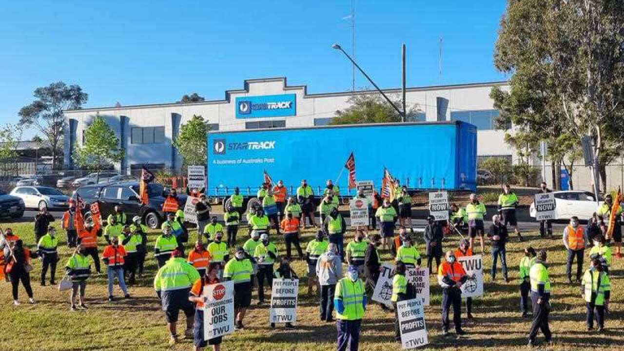 A supplied image obtained on Thursday, September 23, 2021, of StarTrack workers on strike in Sydney after crisis talks failed. Parcel deliveries across the country are being affected by a strike by up to 2000 StarTrack couriers who are in a dispute over p