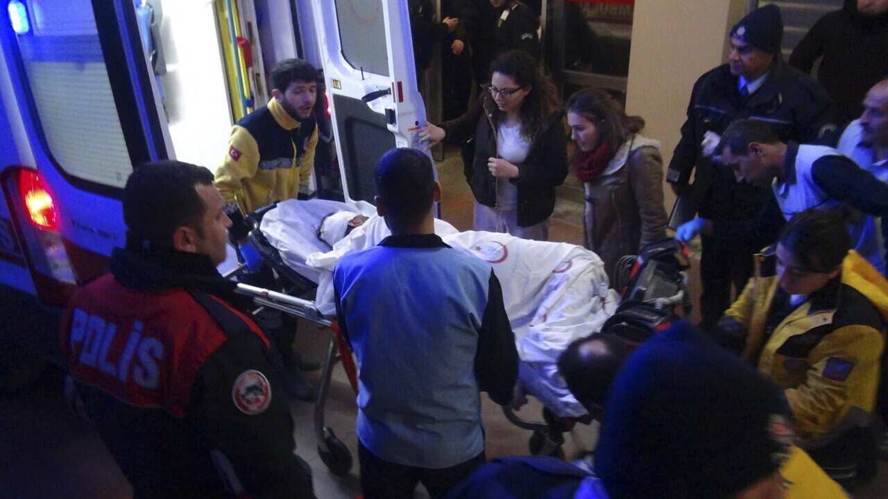 Paramedics carry a victim of a car bomb attack at a hospital in Viransehir, southeastern Turkey