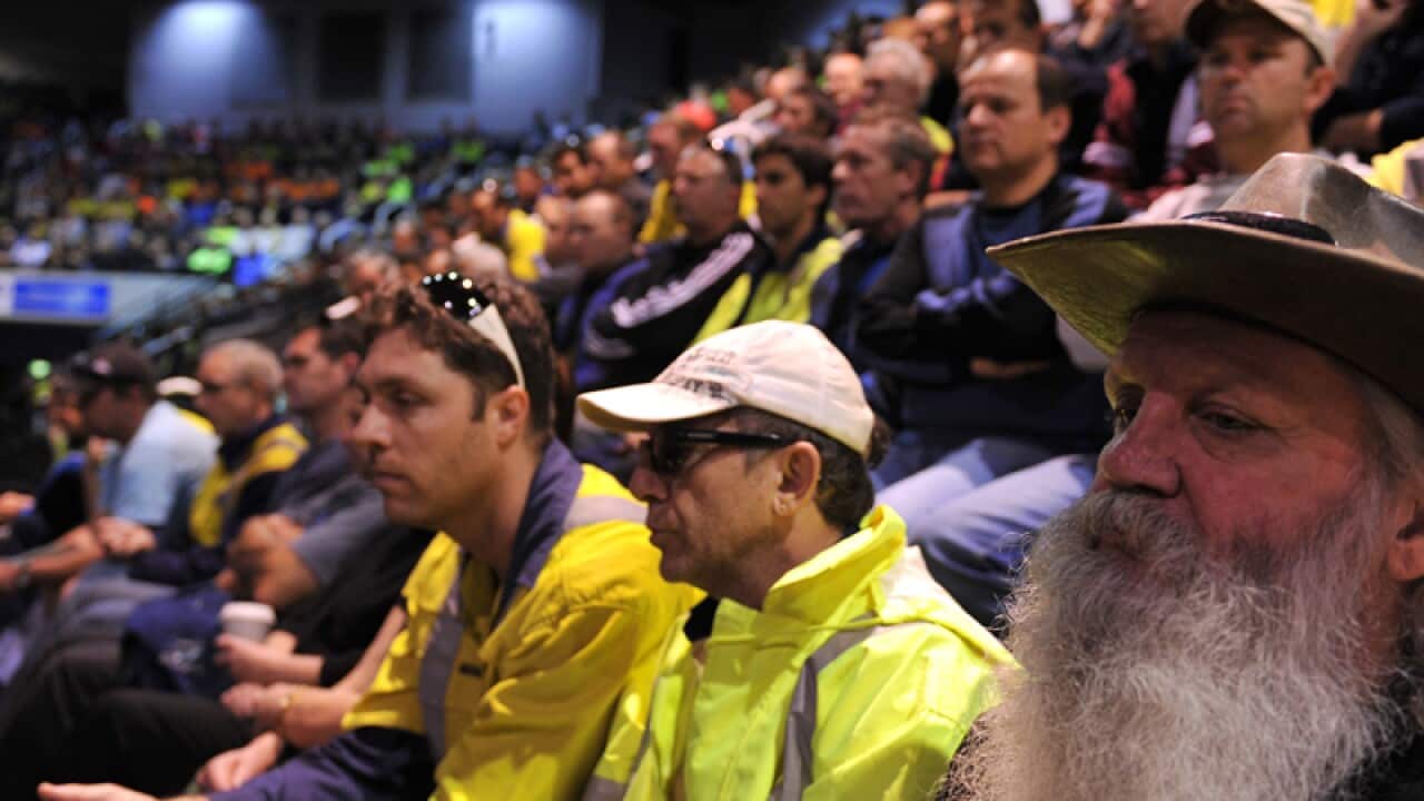 Port Kembla workers attend a union meeting in Wollongong