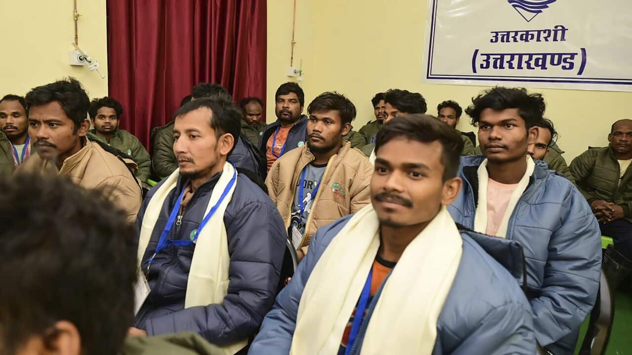 Some of the rescued workers, sitting for a phone call with Indian PM Narendra Modi