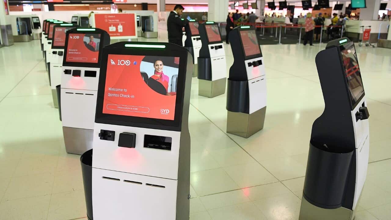 Deserted Qantas self-check -in kiosk at the airport