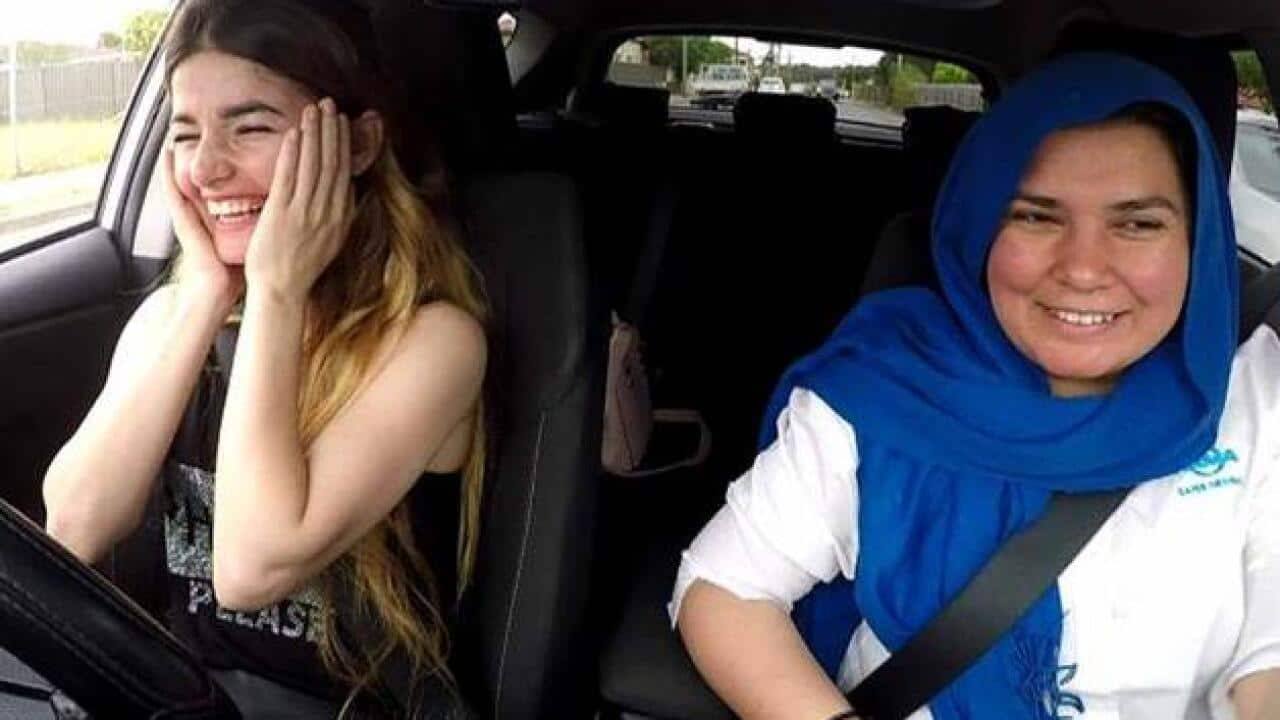 Syrian refugee Babel Youkhana with driving instructor Noor Sheerazi