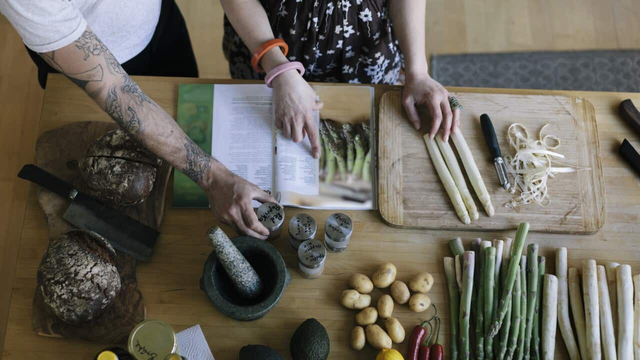 Couple reading food recipe