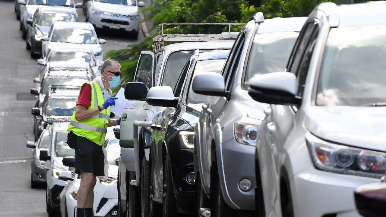 Brisbane residents queue to be processed through a drive-in COVID testing site at Bowen Hills in Brisbane, Monday, March 29, 2021
