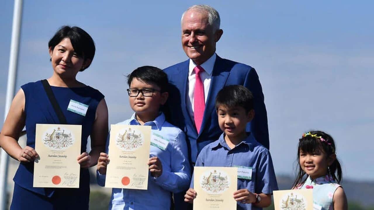 Prime Minister Malcolm Turnbull with new Australian citizens in Canberra.