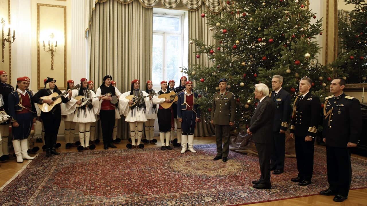 Prokopis Pavlopoulos receiving the Christmas carols by the Presidential guard