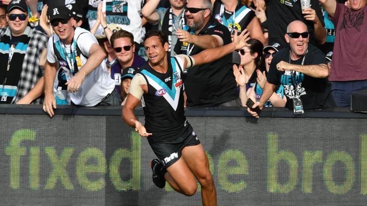 Steven Motlop of the Power celebrates a goal.
