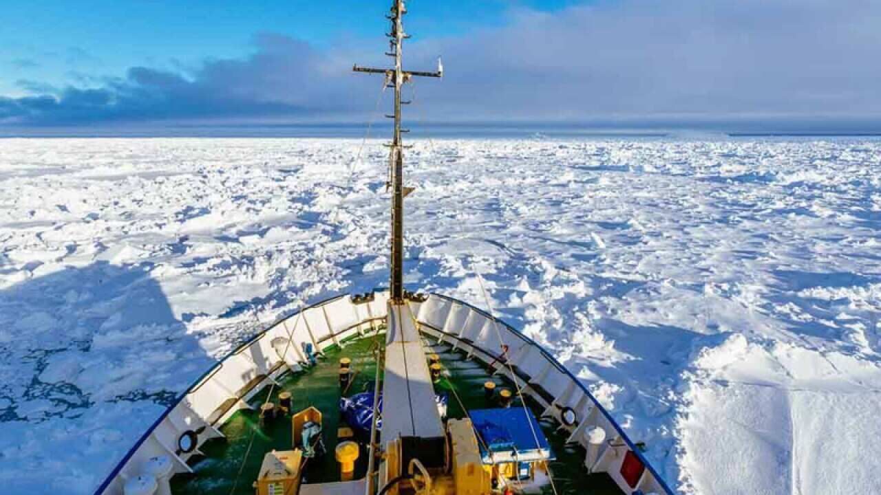A cruise liner stuck in sheets of sea ice near Antarctica