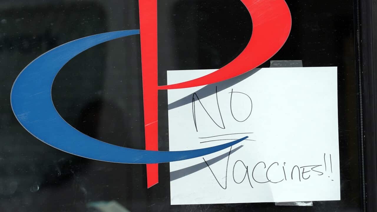 A sign on the entrance to a Brooklyn health care facility