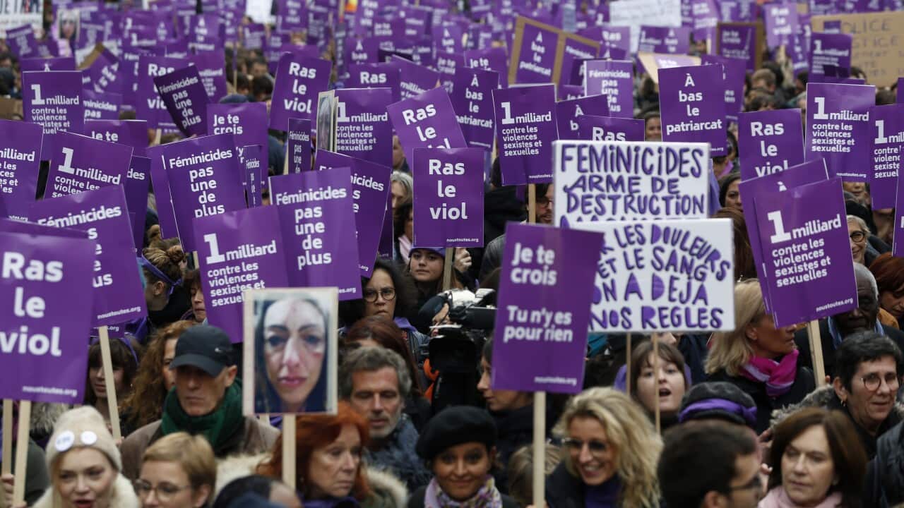 Protesters march through the streets of Paris in a coordinated demonstration condemning domestic violence and sexual assault.
