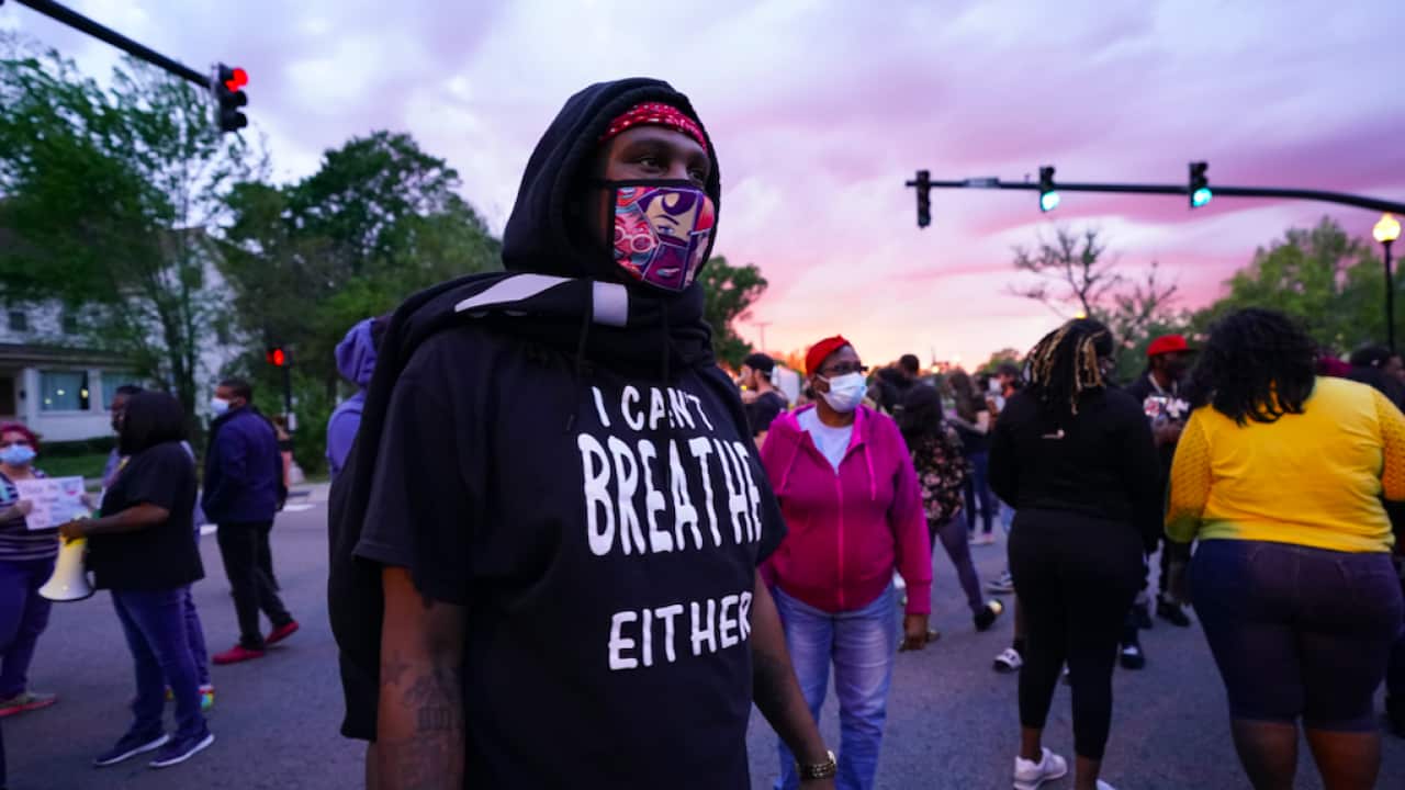People stand in an intersection after the fatal police shooting of Andrew Brown in Elizabeth City, North Carolina