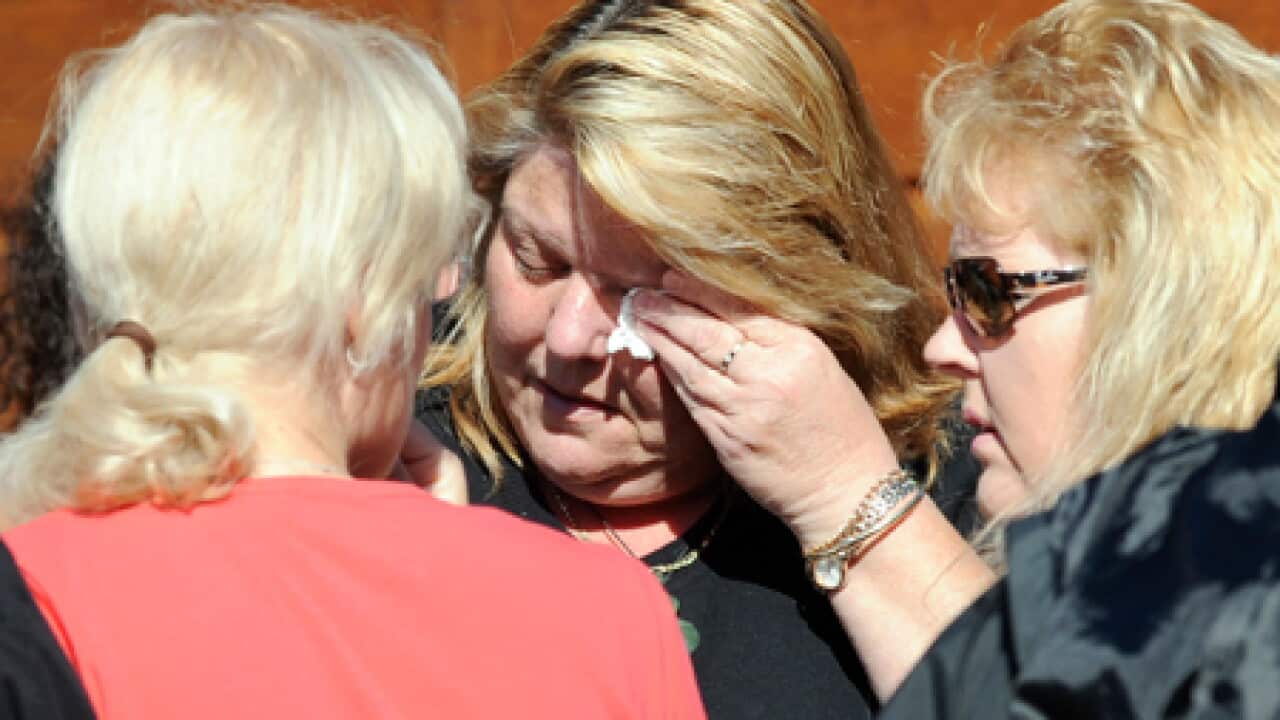 mine_families_cry_101123_B_AAP_1049527047