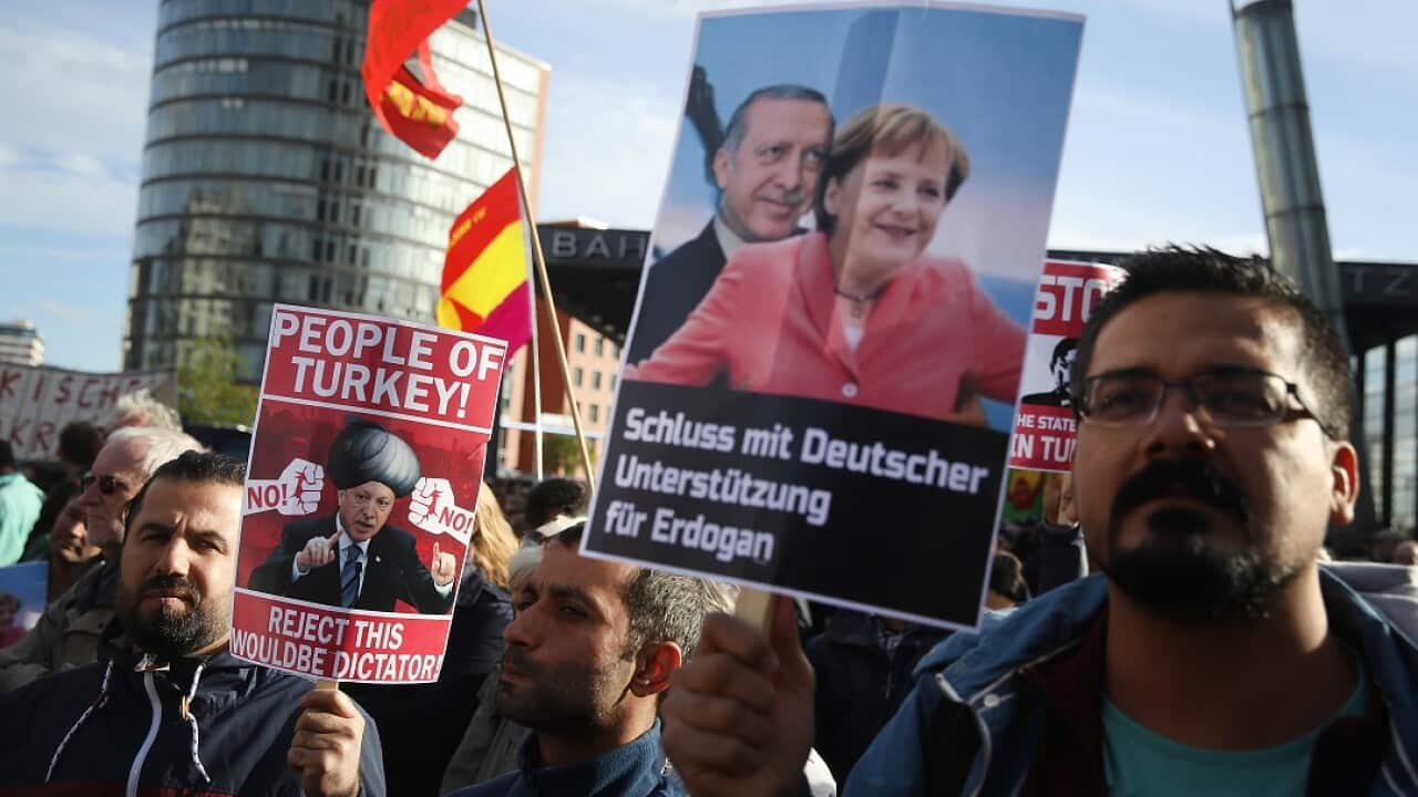 Protesters take part in a march against the visit of Turkish President Recep Tayyip Erdogan in Berlin.