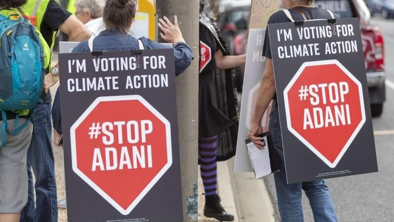 Climate change protestors are seen in Brisbane.
