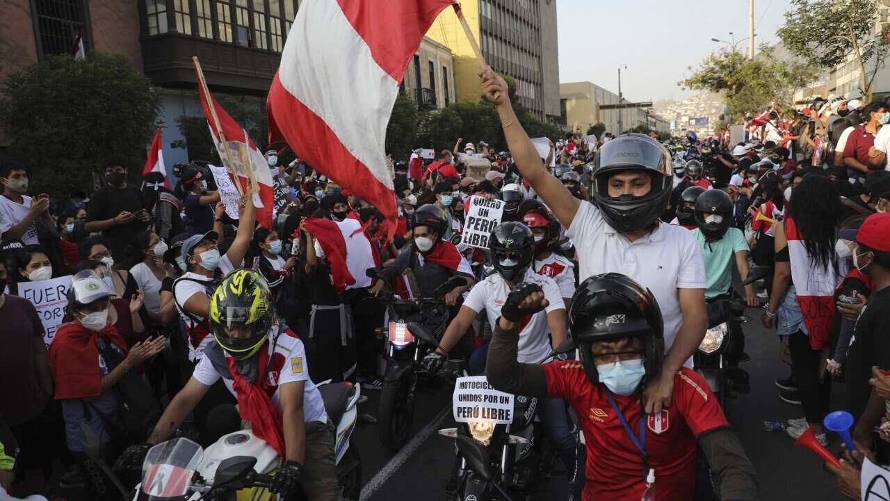 A caravan of demonstrators on motorcycles ride after interim President Manuel Merino resigned his post