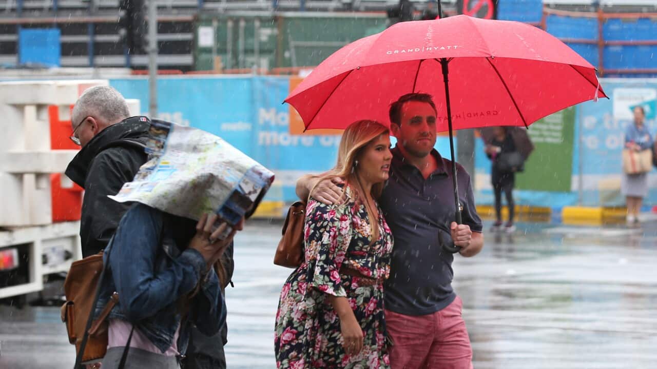 Pedestrians are seen during a rainy day in Melbourne.