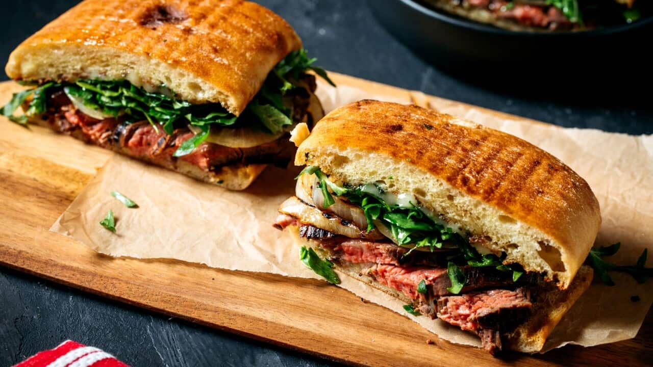 Marinated steak sandwiches with charred onions