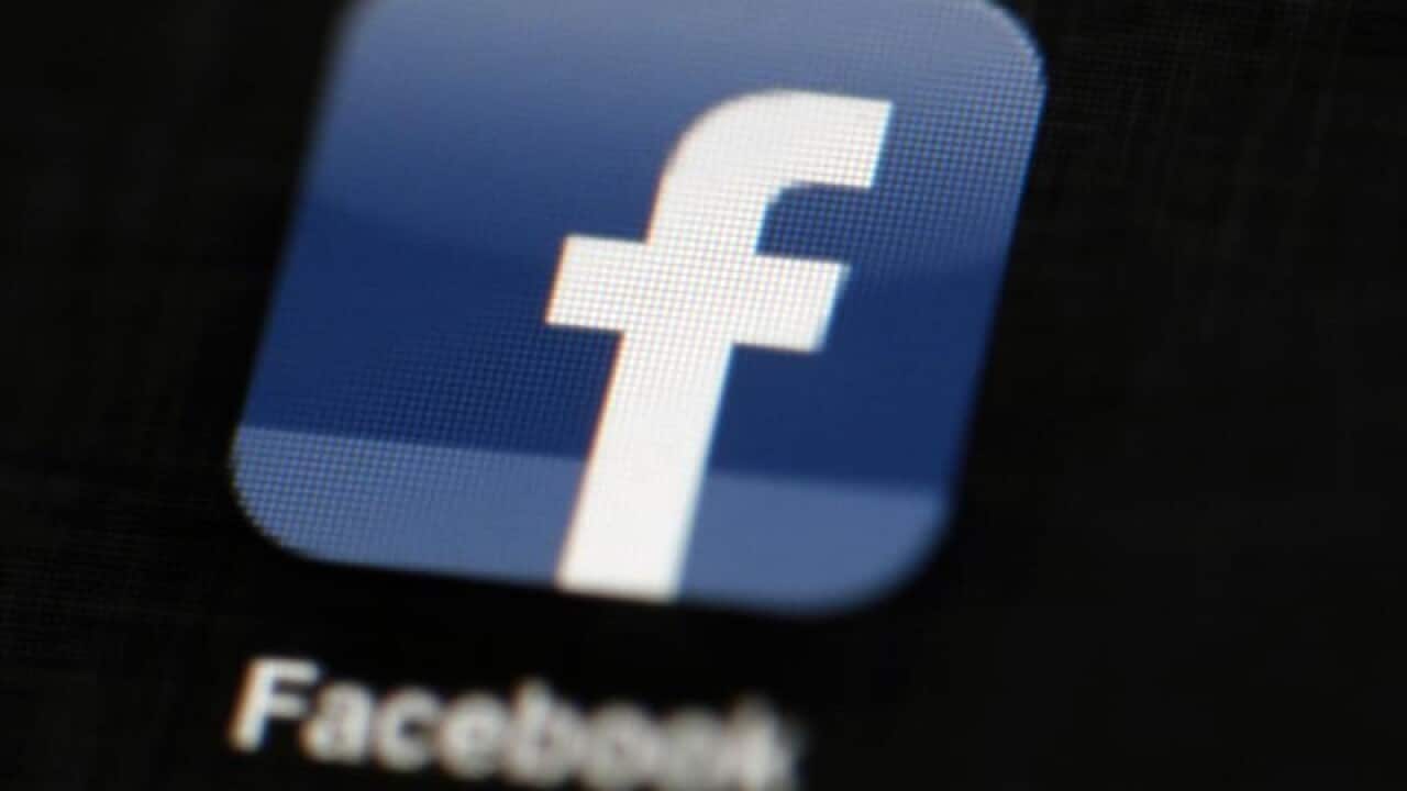 the Facebook logo is displayed on an iPad