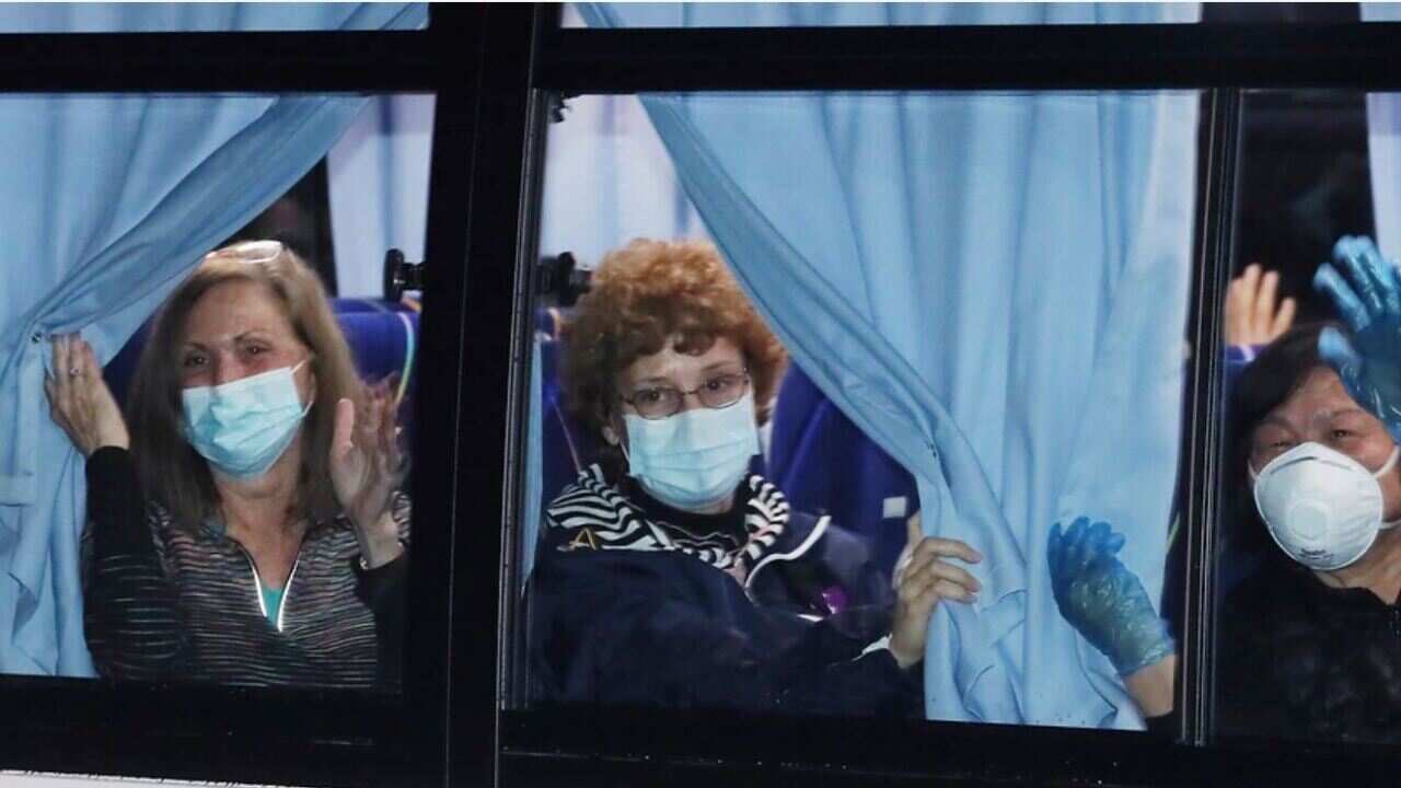 One of the 10 buses is taking U.S. nationals from Yokohama port to the airport.