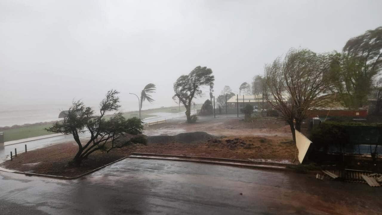 Strong winds and heavy rain from tropical Cyclone Narelle lash a coastal town.