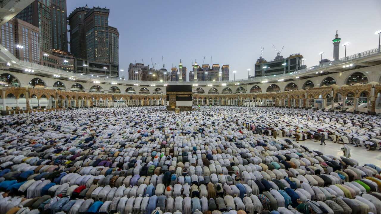 Muslim pilgrims perform prayers around the Kaaba