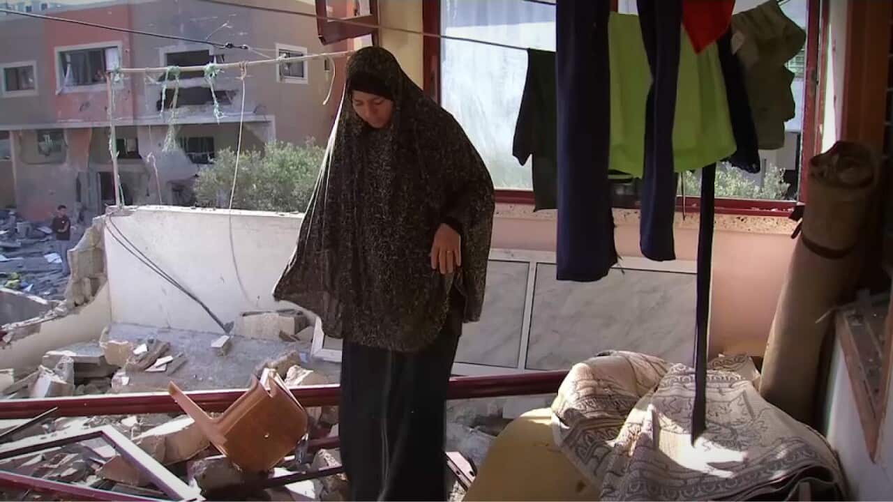 Fawziah Shamalakh surveys the wreckage of her bombed home in Gaza (AP).jpg