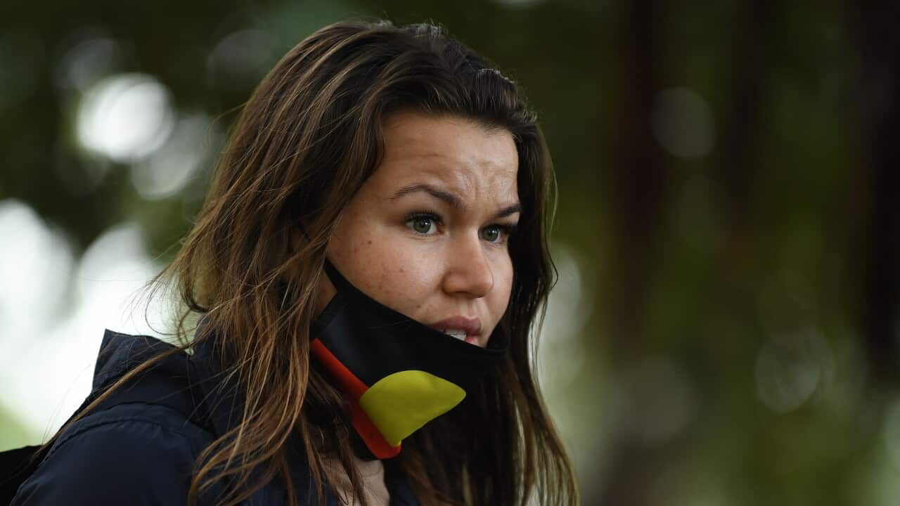 Vanessa Turnbull-Roberts speaks with media after being detained by NSW Police during a Black Lives Matter protest in Sydney, Tuesday, July 28, 2020. (AAP Image/Joel Carrett) NO ARCHIVING